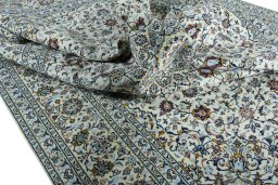 Surface texture of 2000s Kashan rug with natural Wool and intricate pattern
