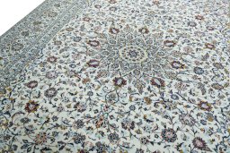 Backside of handmade 2000s Kashan rug showing knot structure and weave density