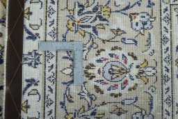 Close-up detail of 2000s Kashan rug from Iran / Persia showing Wool weave