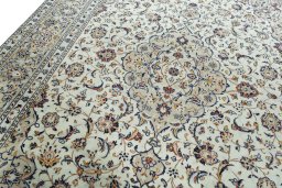 Backside of handmade 2000s Kashan rug showing knot structure and weave density