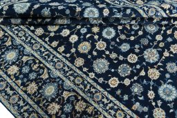 Close-up detail of 2000s Kashan rug from Iran / Persia showing Wool weave