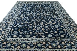 Surface texture of 2000s Kashan rug with natural Wool and intricate pattern