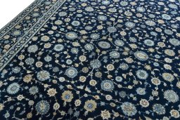 Backside of handmade 2000s Kashan rug showing knot structure and weave density
