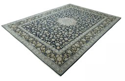 Corner detail of 2000s Kashan rug showing border pattern and Wool pile