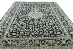 Surface texture of 2000s Kashan rug with natural Wool and intricate pattern
