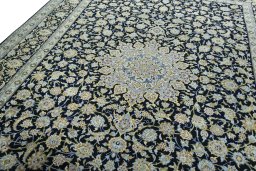 Backside of handmade 2000s Kashan rug showing knot structure and weave density