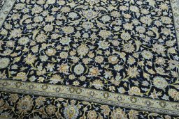 Close-up detail of 2000s Kashan rug from Iran / Persia showing Wool weave