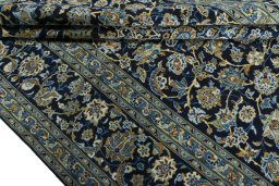 Close-up detail of 2000s Kashan rug from Iran / Persia showing Wool weave