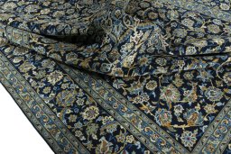 Surface texture of 2000s Kashan rug with natural Wool and intricate pattern