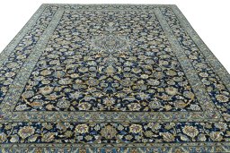 Surface texture of 2000s Kashan rug with natural Wool and intricate pattern