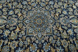Central medallion detail of 2000s Kashan rug from Iran / Persia