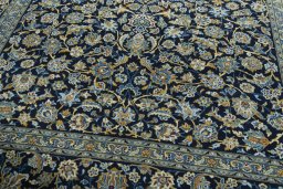 Close-up detail of 2000s Kashan rug from Iran / Persia showing Wool weave