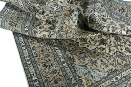 Surface texture of 2000s Kashan rug with natural Wool and intricate pattern