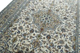 Backside of handmade 2000s Kashan rug showing knot structure and weave density