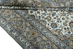 Close-up detail of 2000s Kashan rug from Iran / Persia showing Wool weave