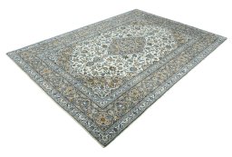 Corner detail of 2000s Kashan rug showing border pattern and Wool pile