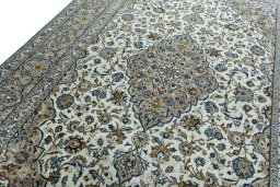 Backside of handmade 2000s Kashan rug showing knot structure and weave density