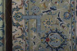 Backside of handmade 2000s Kashan rug showing knot structure and weave density