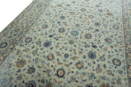 Backside of handmade 2000s Kashan rug showing knot structure and weave density