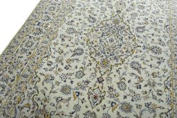 Backside of handmade 2000s Kashan rug showing knot structure and weave density