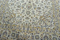 Close-up detail of 2000s Kashan rug from Iran / Persia showing Wool weave