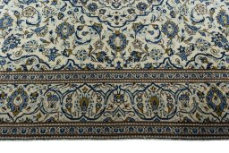 Corner detail of 2000s Kashan rug showing border pattern and Wool pile