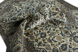Surface texture of 2000s Kashan rug with natural Wool and intricate pattern