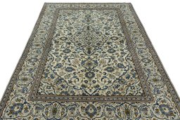 Surface texture of 2000s Kashan rug with natural Wool and intricate pattern