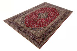 Corner detail of 2000s Kashan rug showing border pattern and Wool pile