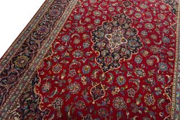 Backside of handmade 2000s Kashan rug showing knot structure and weave density