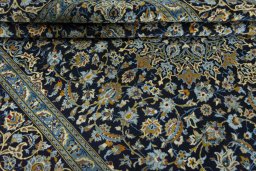 Close-up detail of 2000s Kashan rug from Iran / Persia showing Wool weave