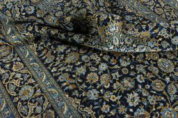 Surface texture of 2000s Kashan rug with natural Wool and intricate pattern