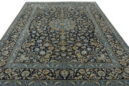 Surface texture of 2000s Kashan rug with natural Wool and intricate pattern