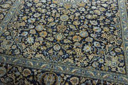 Close-up detail of 2000s Kashan rug from Iran / Persia showing Wool weave