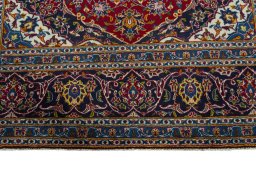 Full view of 2000s Kashan rug from Iran / Persia, 307 × 207 cm in Red tones