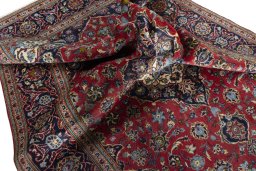 Surface texture of 2000s Kashan rug with natural Wool and intricate pattern