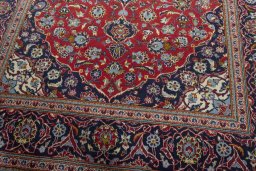 Close-up detail of 2000s Kashan rug from Iran / Persia showing Wool weave
