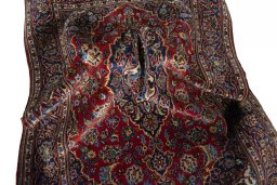 Surface texture of 2000s Kashan rug with natural Wool and intricate pattern