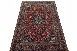 Surface texture of 2000s Kashan rug with natural Wool and intricate pattern