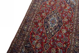 Backside of handmade 2000s Kashan rug showing knot structure and weave density