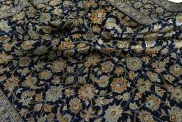 Surface texture of 2000s Kashan rug with natural Wool and intricate pattern