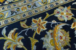 Central medallion detail of 2000s Kashan rug from Iran / Persia