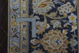 Close-up detail of 2000s Kashan rug from Iran / Persia showing Wool weave