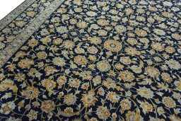 Backside of handmade 2000s Kashan rug showing knot structure and weave density