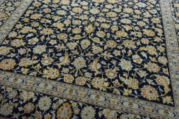 Close-up detail of 2000s Kashan rug from Iran / Persia showing Wool weave