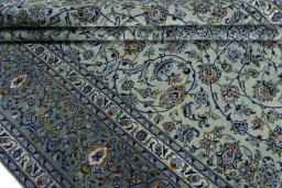 Close-up detail of 2000s Kashan rug from Iran / Persia showing Wool weave