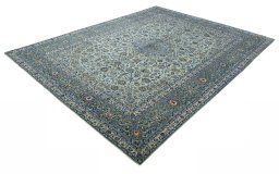 Corner detail of 2000s Kashan rug showing border pattern and Wool pile