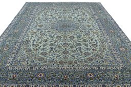 Surface texture of 2000s Kashan rug with natural Wool and intricate pattern