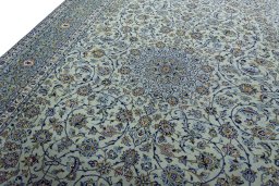 Backside of handmade 2000s Kashan rug showing knot structure and weave density