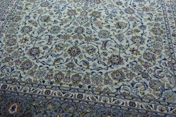 Close-up detail of 2000s Kashan rug from Iran / Persia showing Wool weave